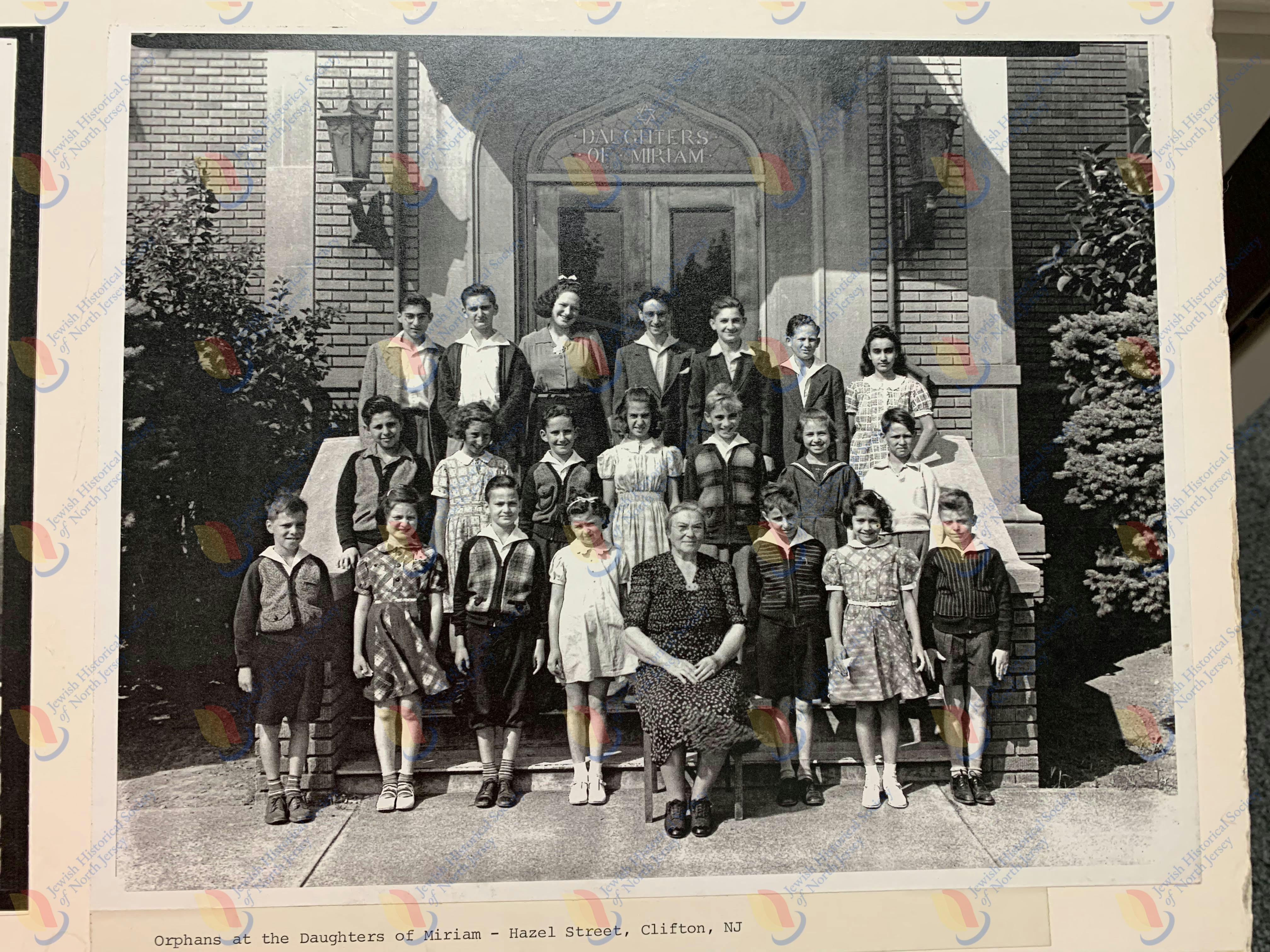 Photo of orphans with Director (?) of the orpanage.