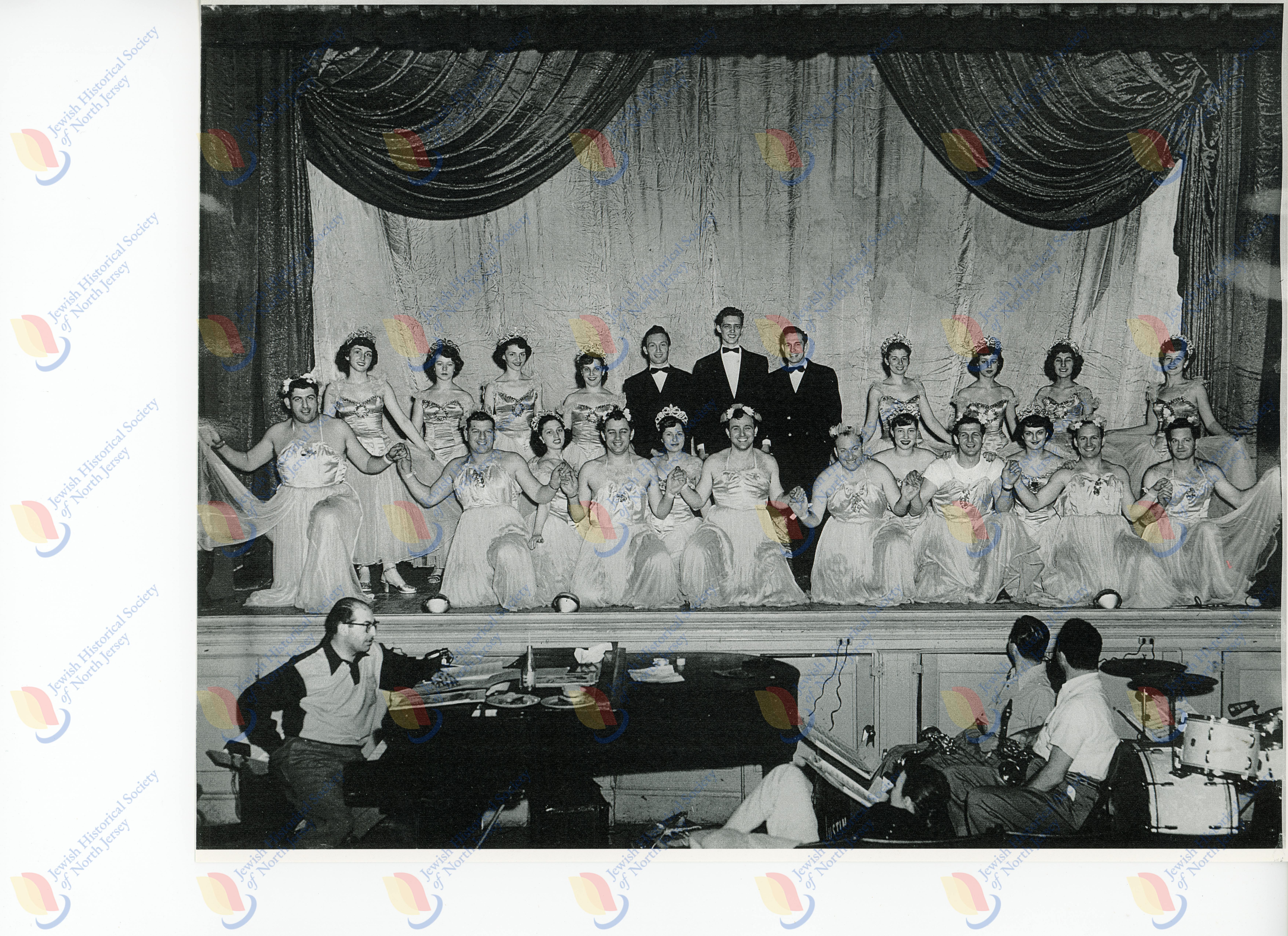 Male & Female performers posing onstage